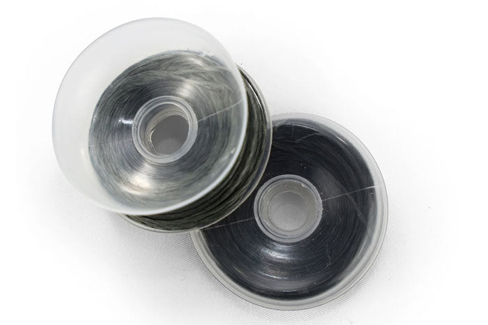 [2 spools of trip line for perimeter trip alarm]]