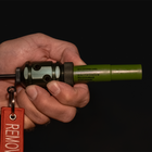 Hand holding the Fith Ops Gen4 2-in-1 Rescue Device with OD Green Waterproof Sight and Sound Shells - Thumbnail Image